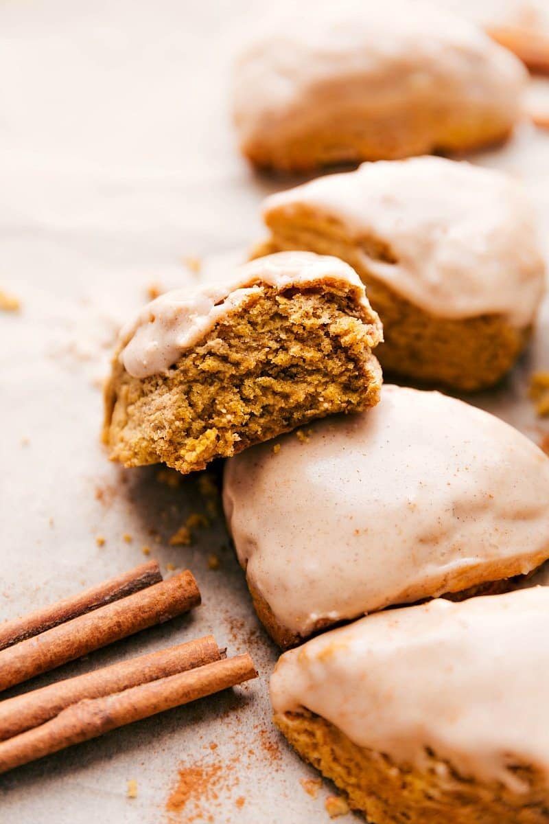 Pumpkin scones with a satisfying glaze on top and bite out of one of them.