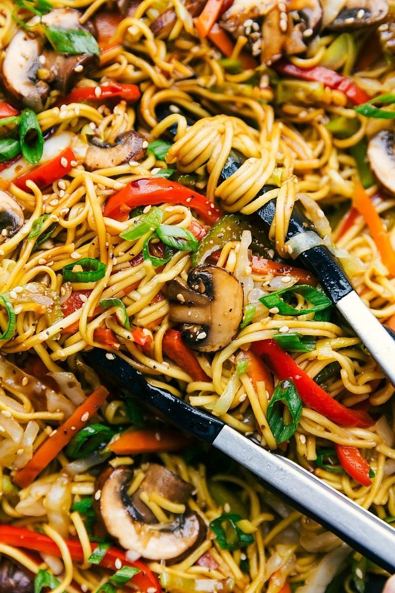 Vegetarian recipes: chow mein noodles coated in sauce with mixed vegetables throughout.