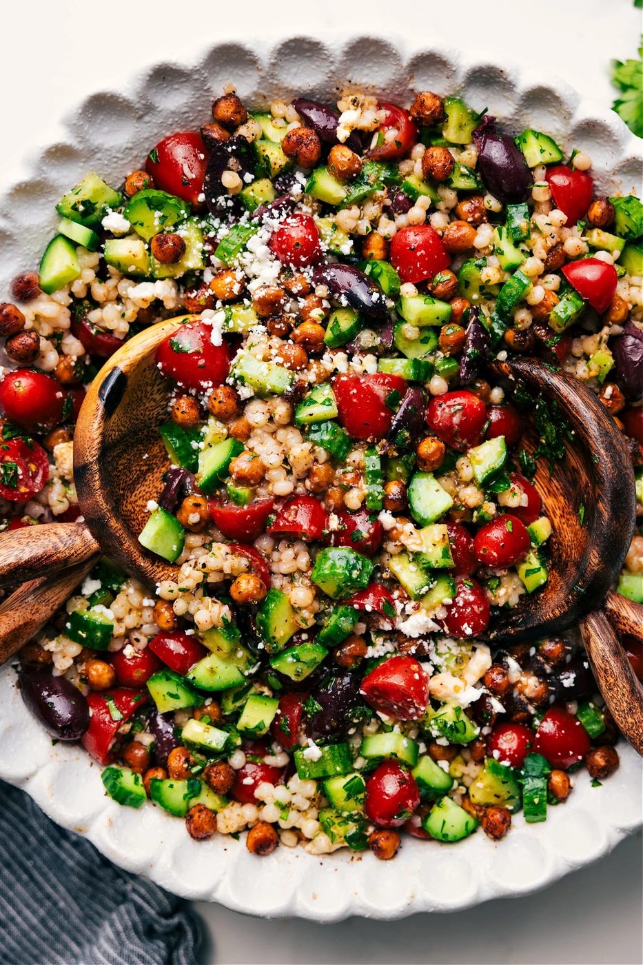 Salad filled with veggies, beans, and dressing.