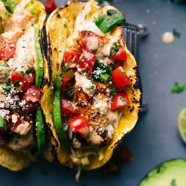 Two fish tacos stuffed with satisfying toppings, ready to be savored.