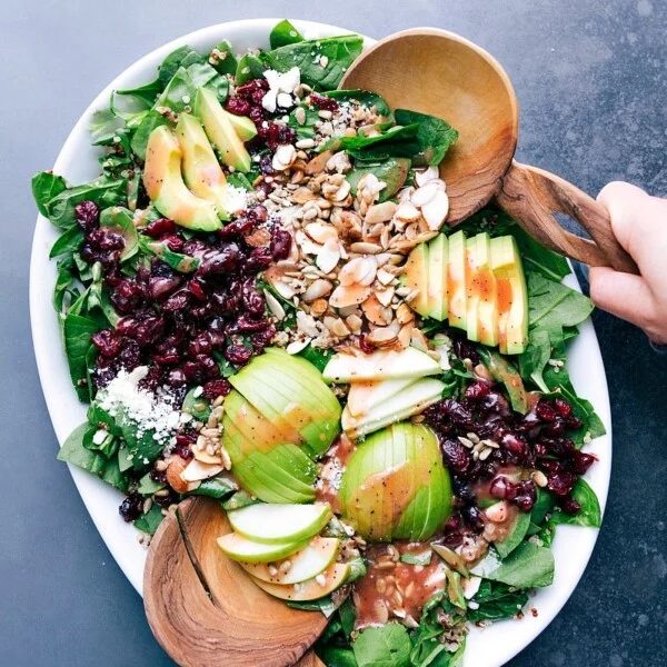 Quinoa and almond salad ready to be tossed together, all the fresh ingredients satisfying and complimentary.