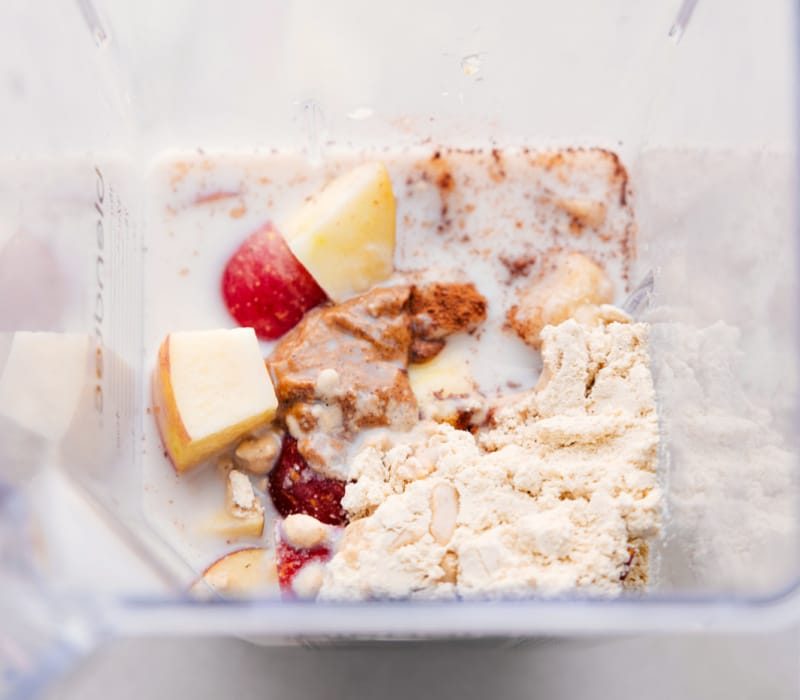 Blender full of Apple Smoothie ingredients.