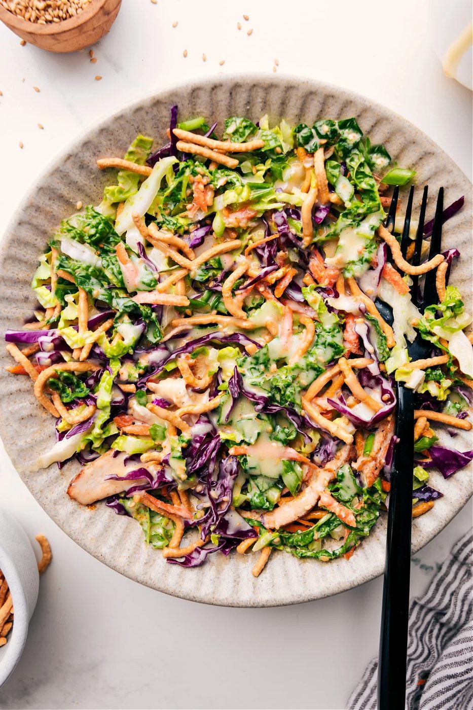 Asian chicken salad in a bowl dressed with the best creamy dressing.