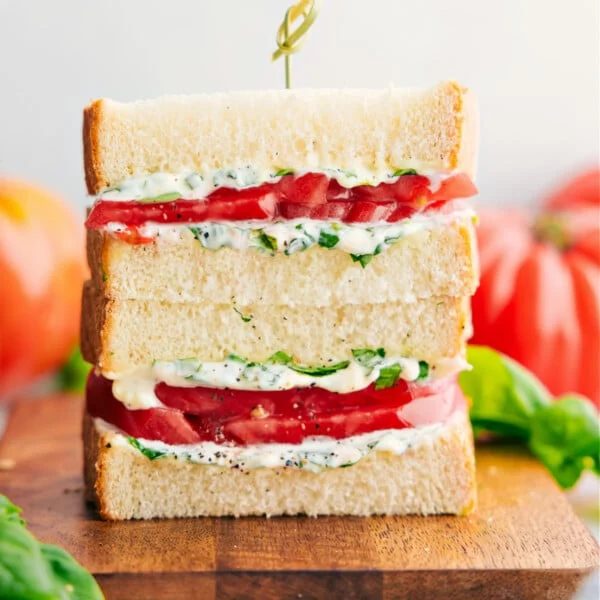 Tomato Sandwich stacked on top of each other showing the satisfying inside.