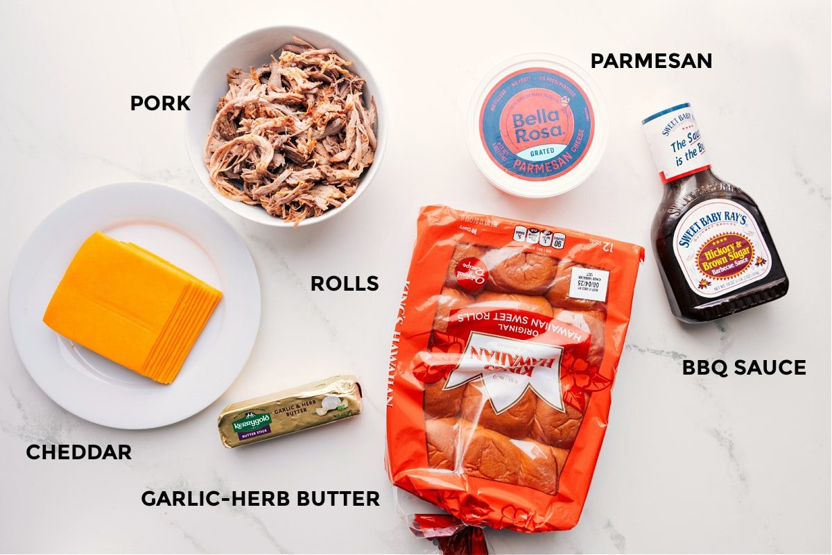 All the ingredients prepped for straightforward assembly: cheddar, garlic-herb butter, Hawaiian rolls, pork, Parmesan, and BBQ sauce.