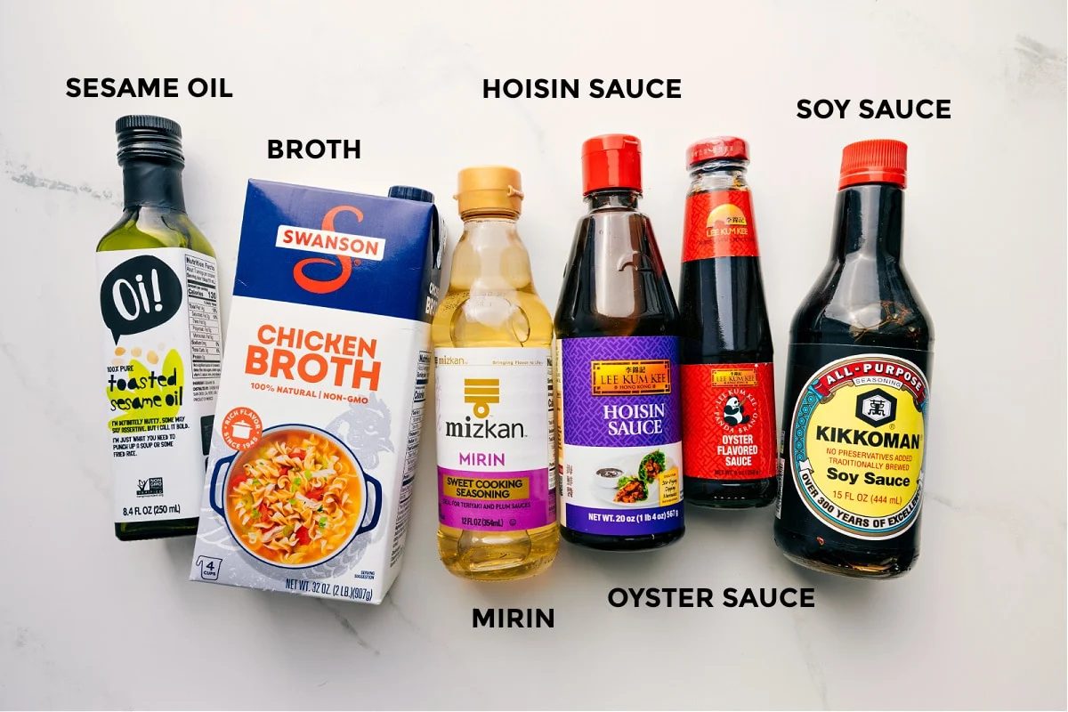 The sauce ingredients prepped out for straightforward assembly including the sesame oil, broth, hoisin sauce, mirin, oyster sauce, and soy sauce.