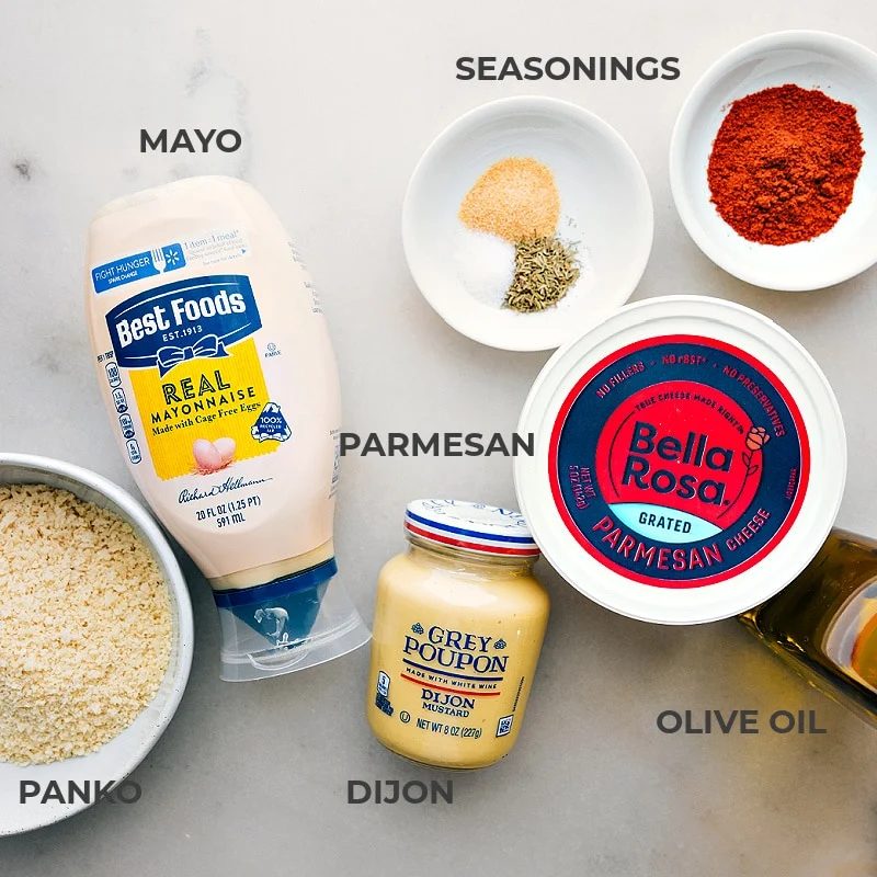 The ingredients used to coat the fish prepped out for straightforward assembly including the panko, mayo, parmesan, dijon, olive oil, and seasonings.