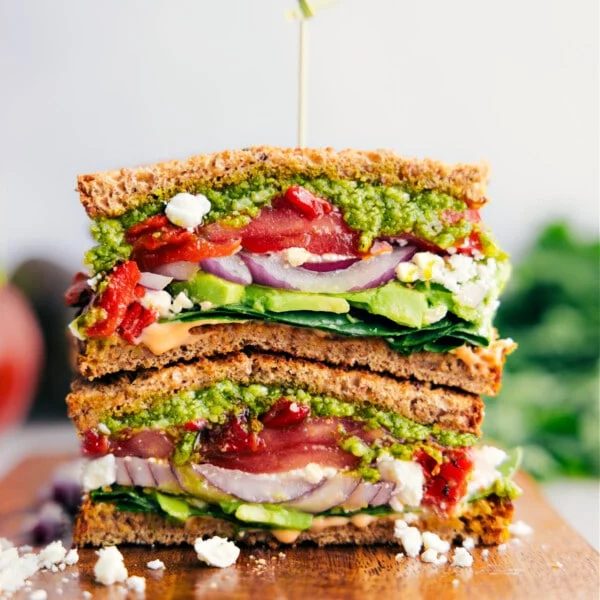 straightforward, vegetarian Mediterranean Sandwich—pile veggies, creamy feta cheese, and basil pesto on hearty bread.