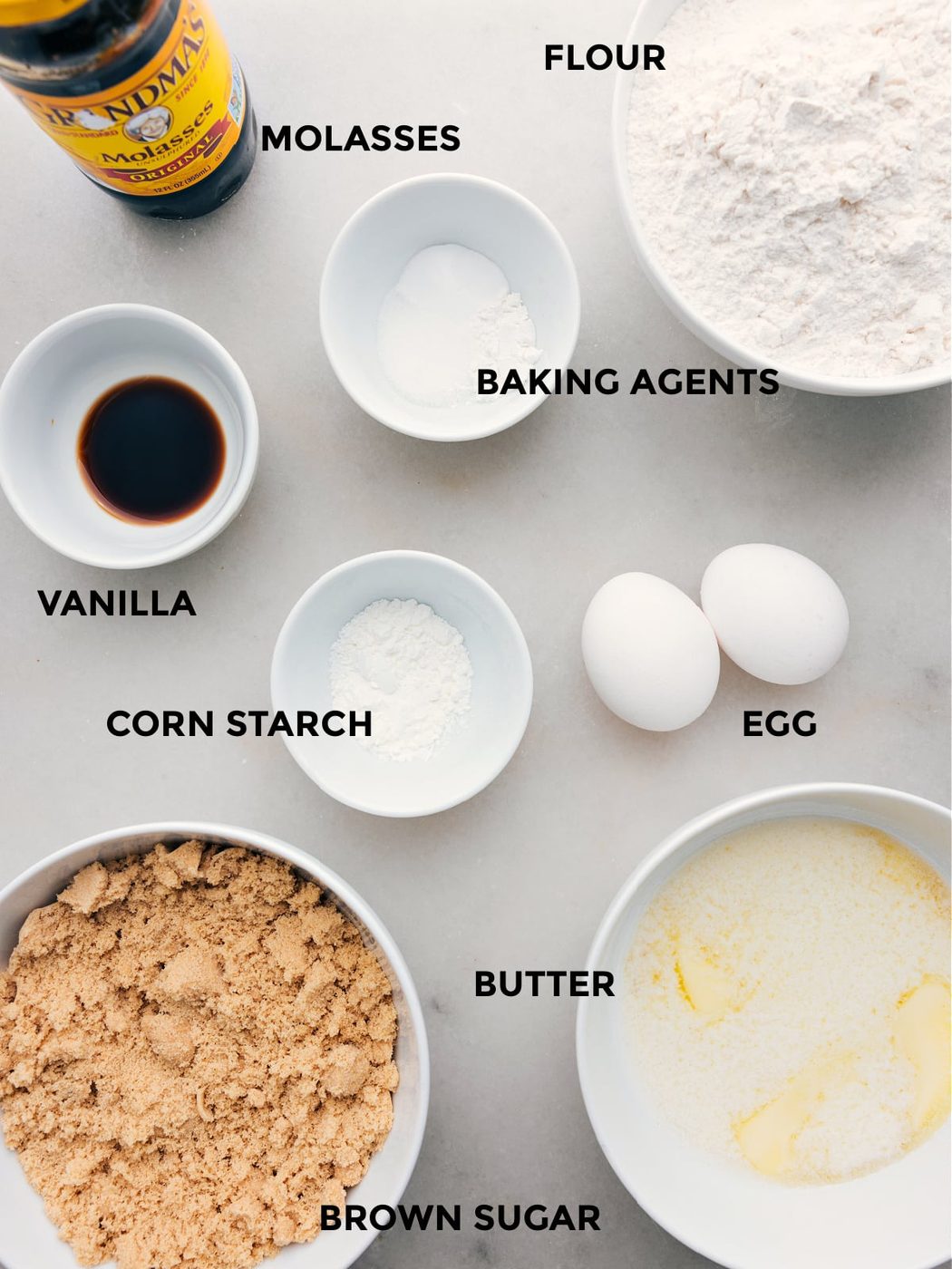 All the ingredients for this recipe, including eggs, cornstarch, butter, sugar, vanilla, and baking agents, are prepped for straightforward assembly.