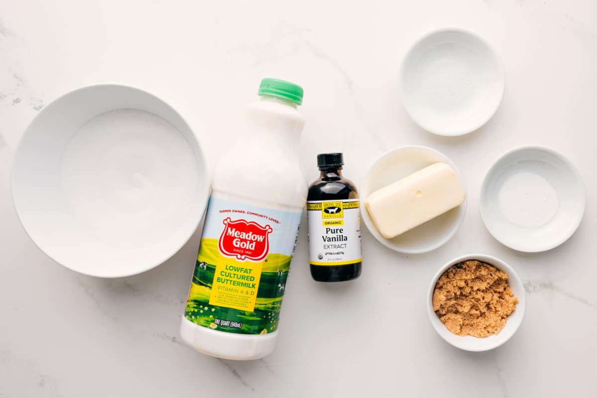 All the ingredients in this recipe prepped out for straightforward assembly including the sugar, buttermilk, vanilla, brown sugar, butter, salt, and baking soda.