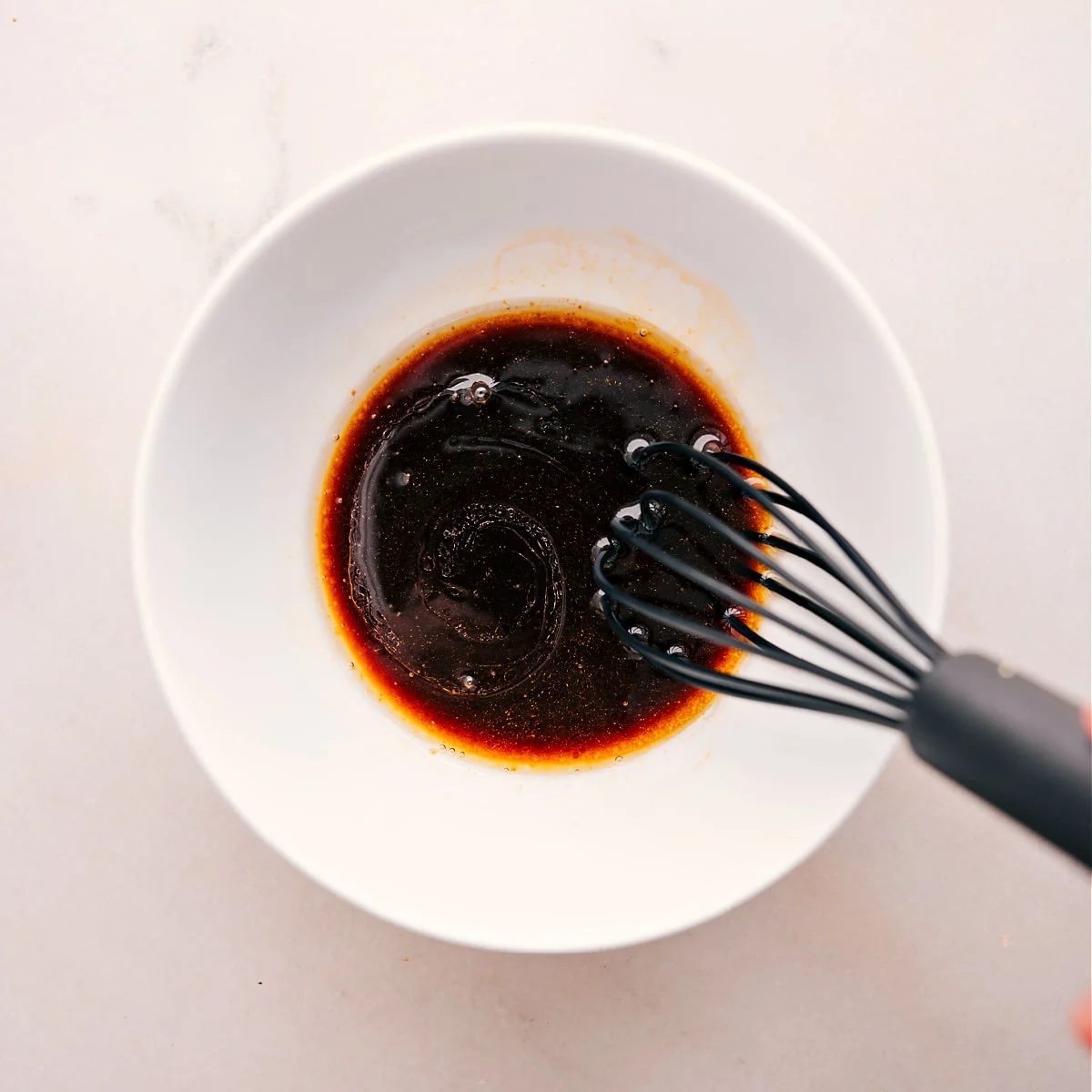 Whisking the sauce for this ground turkey stir fry.