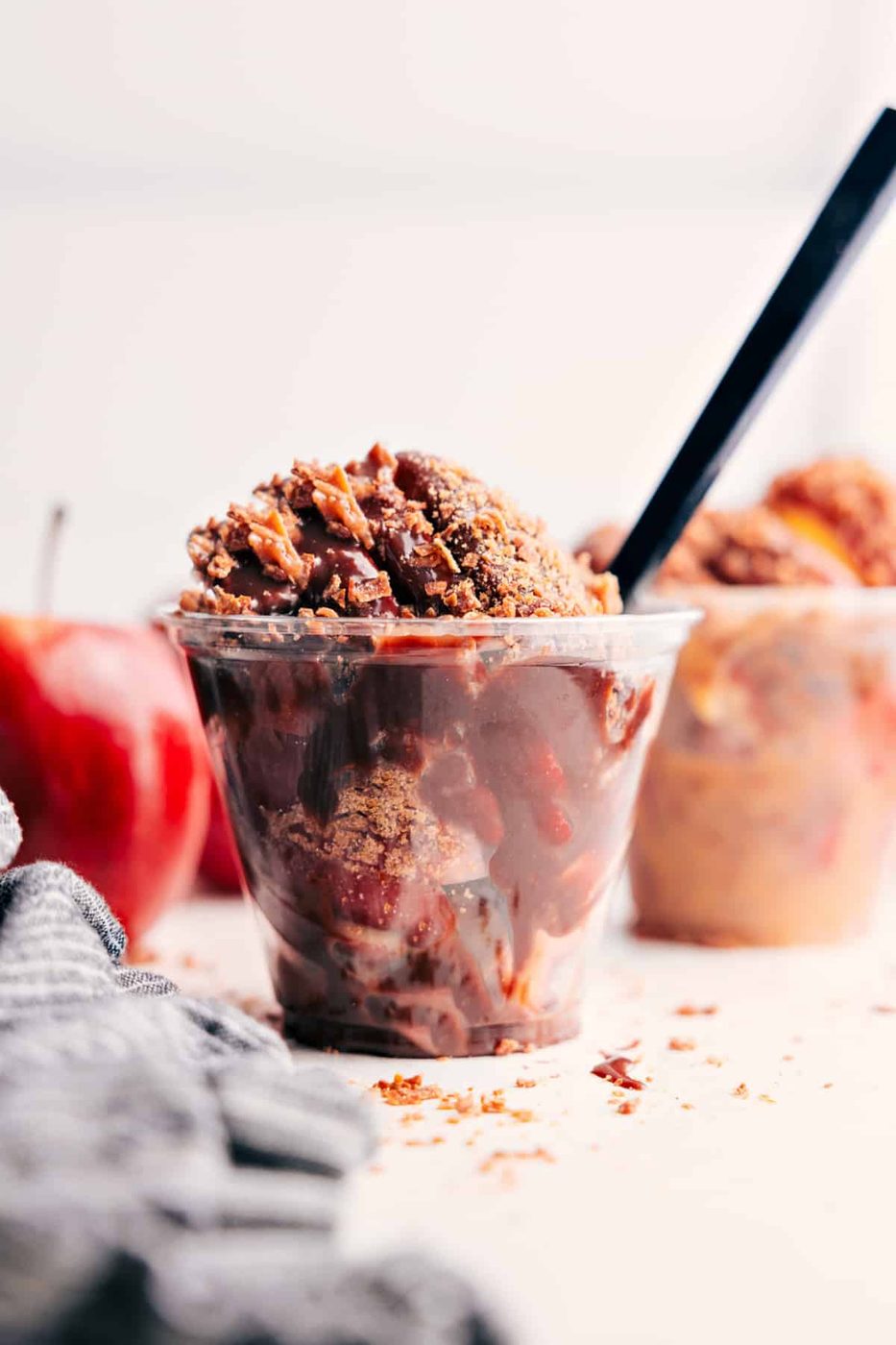 Caramel Apple Dessert Cups topped with extra chocolate and toasted coconut, ready to serve.