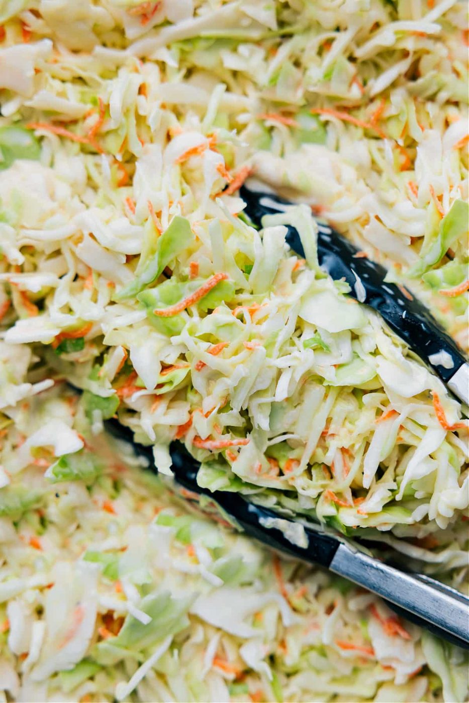 The cabbage, coleslaw, and carrots added to the dressing and it all mixed together.