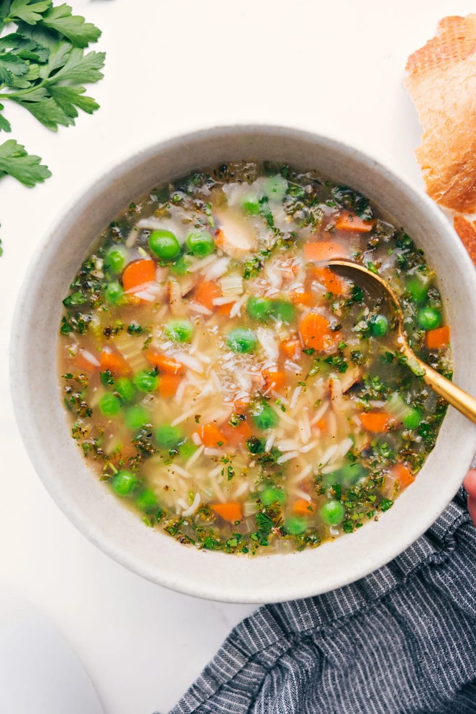 Chicken and Rice Soup Recipe in a bowl with a spoon, ready to enjoy.