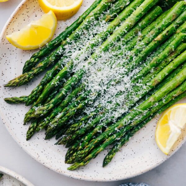 straightforward roasted asparagus with fresh parmesan cheese and lemon slices.