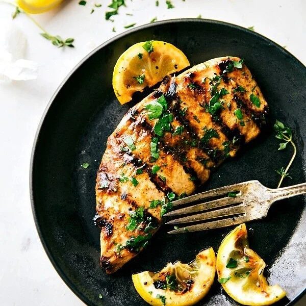The finished meat, evenly flavored and cooked, served on a plate and ready to be enjoyed.