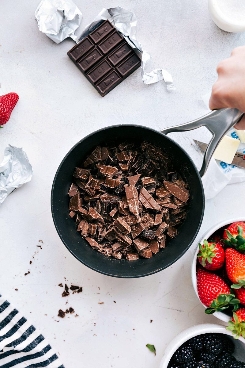 Melting the chocolate in a pot for this chocolate fondue recipe.