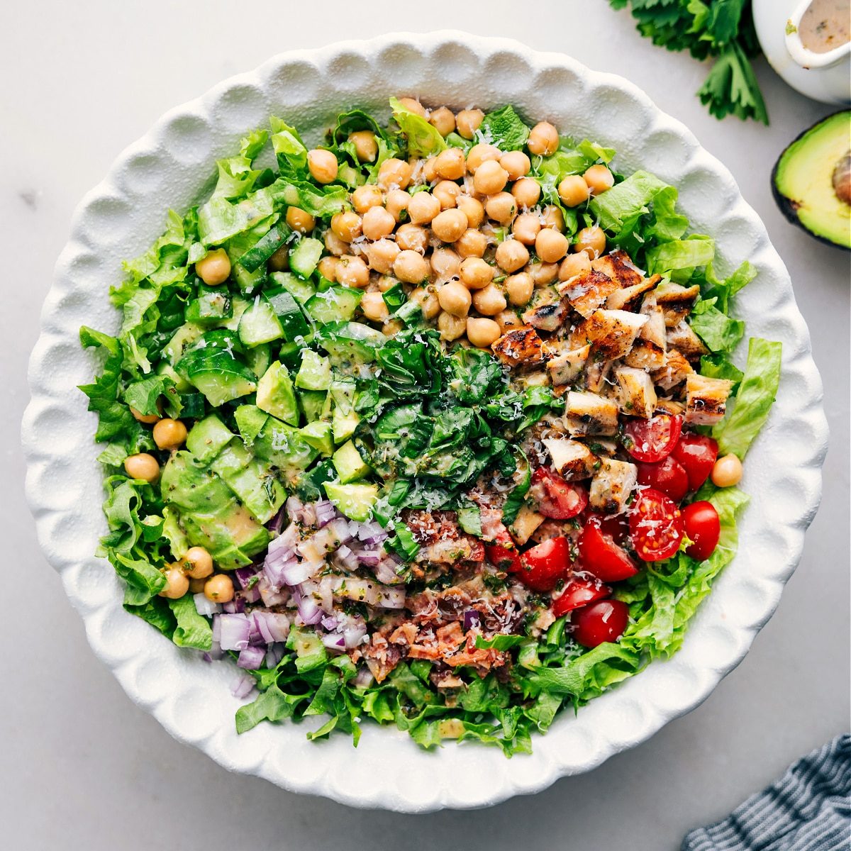 All the ingredients added to a bowl and it all dressed with dressing for this satisfying high protein dish.