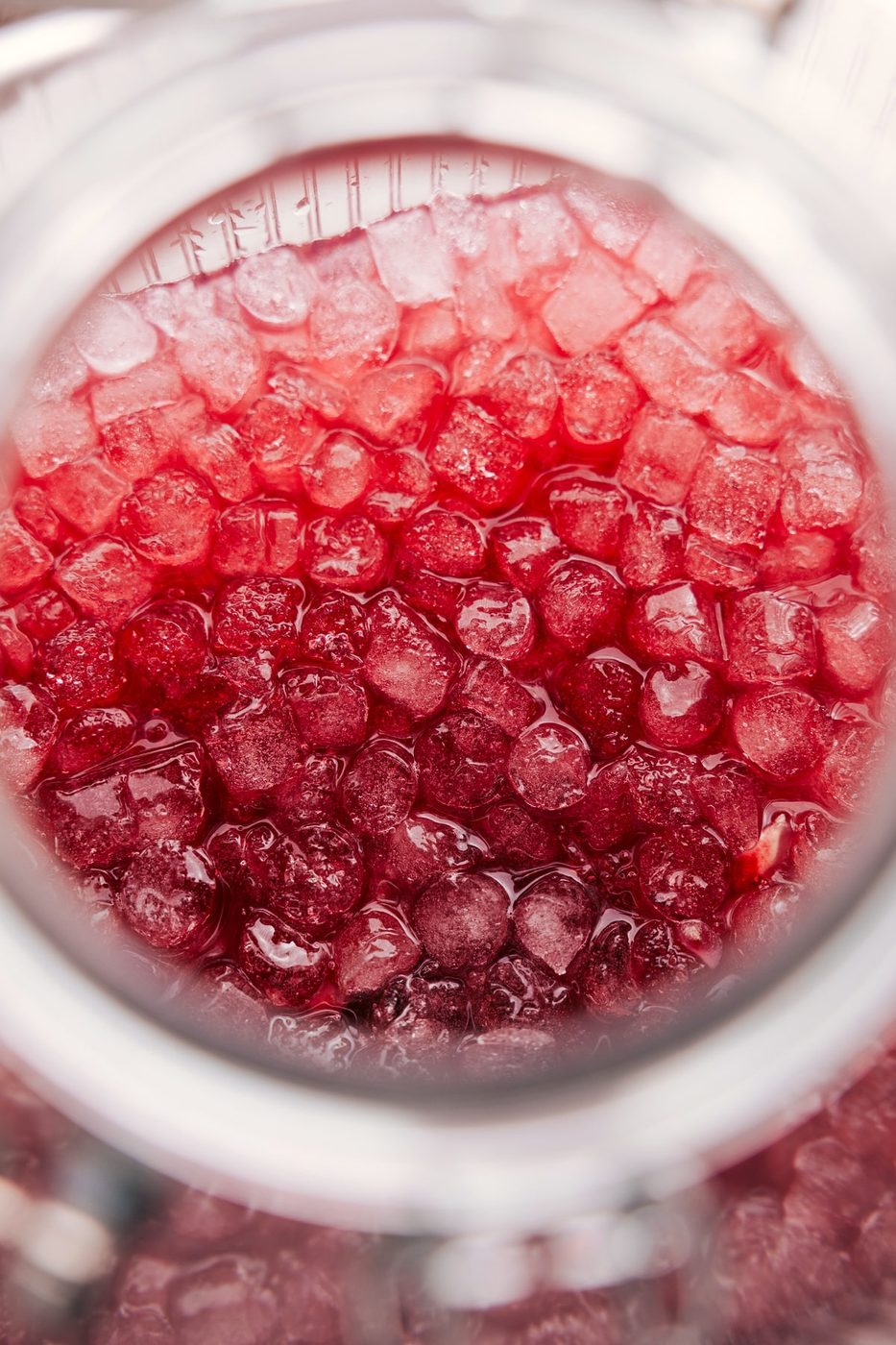 A glass of Christmas Punch Recipe served with crushed ice.