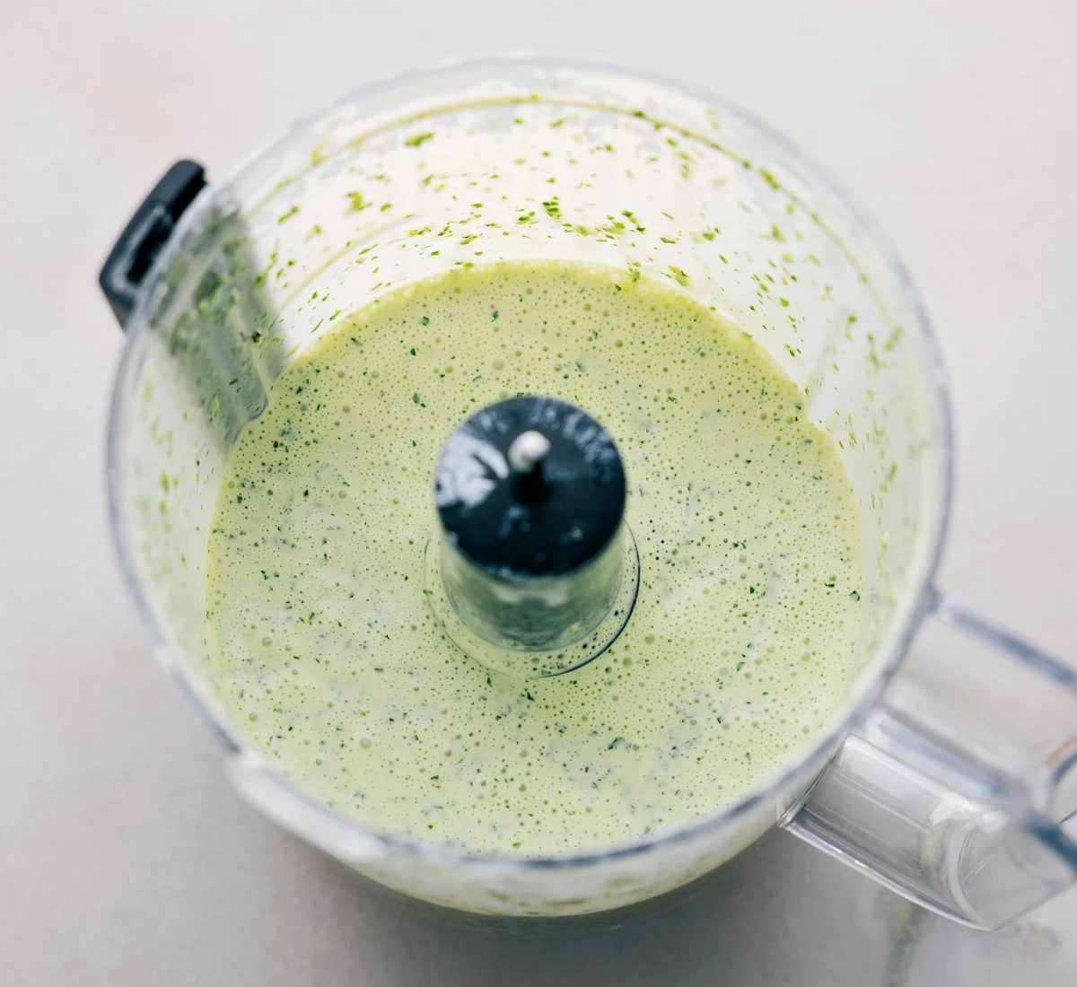 All the ingredients being pulsed together in a food processor.