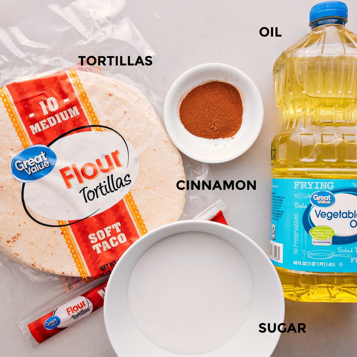 All the ingredients for this recipe—tortillas, cinnamon, sugar, and oil—are prepped and ready for straightforward assembly.