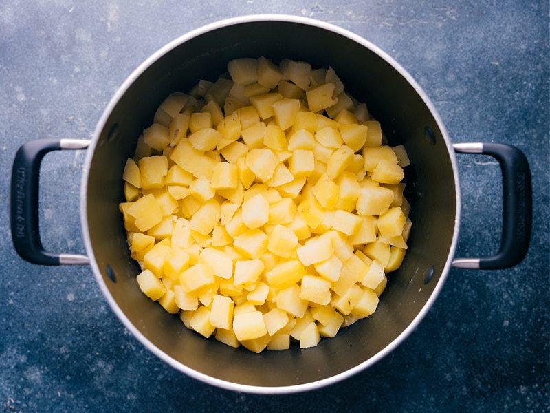 The cooked potatoes strained and. in the pot for this creamed potatoes recipe.