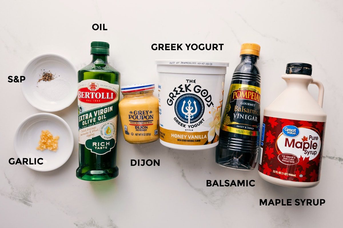 All the ingredients in this recipe prepped out for straightforward assembly including the garlic, oil, dijon, greek yogurt, balsamic, and maple syrup.