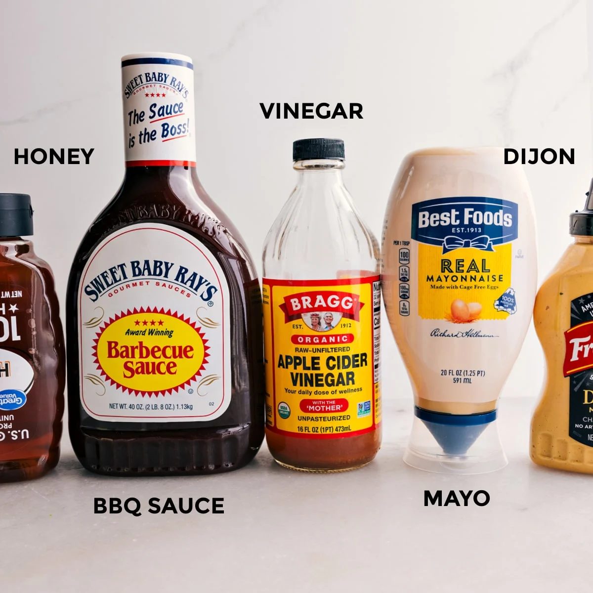 For this crispy chicken salad, the dressing ingredients are prepped for straightforward assembly: honey, BBQ sauce, vinegar, Dijon, and mayo.