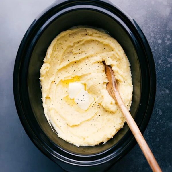 Creamy slow cooker mashed potatoes, evenly seasoned and ready to be enjoyed.