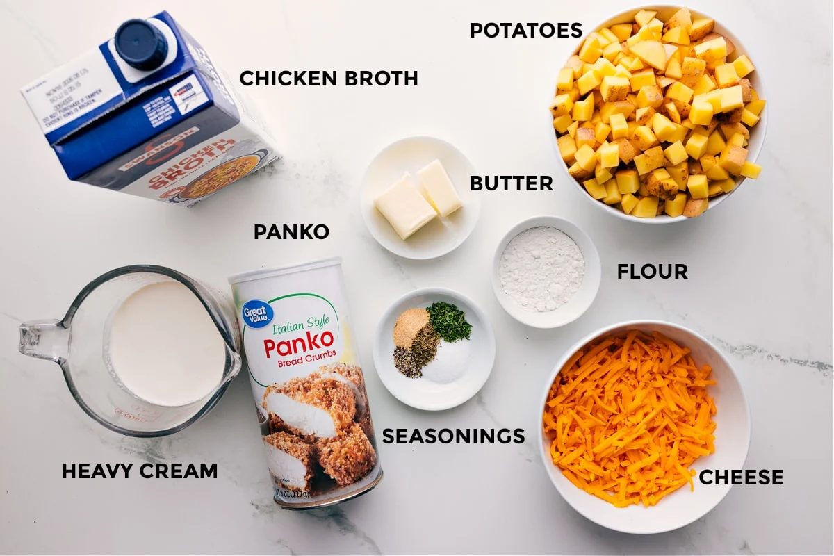 Ingredients in this recipe prepped out for straightforward assembly including the chicken broth, heavy cream, Panko, seasonings, butter, flour, potatoes, and cheese.