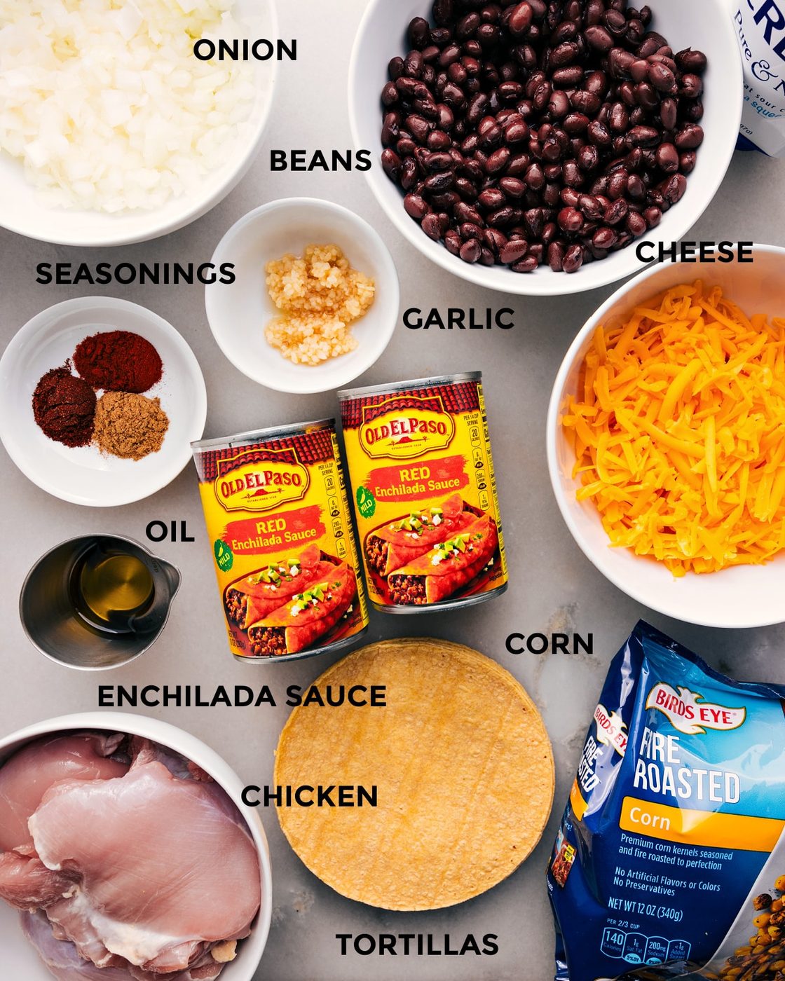 All the ingredients in this recipe—beans, sauce, cheese, tortillas, corn, seasonings, veggies, and meat—are prepped for straightforward assembly.