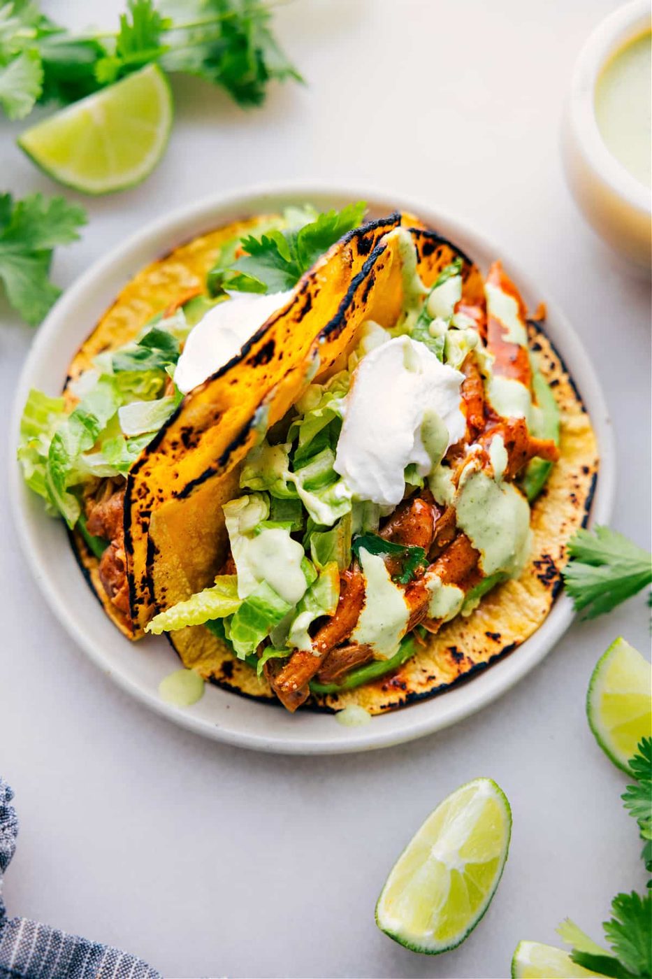 slow cooker chicken recipes featuring shredded chicken tacos loaded with flavorful chicken and fresh toppings.