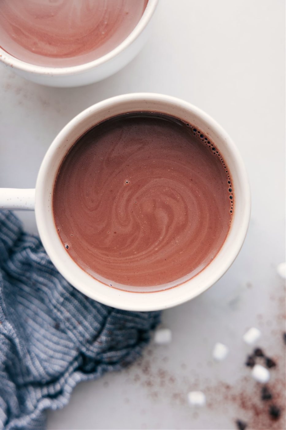 A cup of steaming, swirling hot chocolate, evenly prepared and ready for enjoyment.