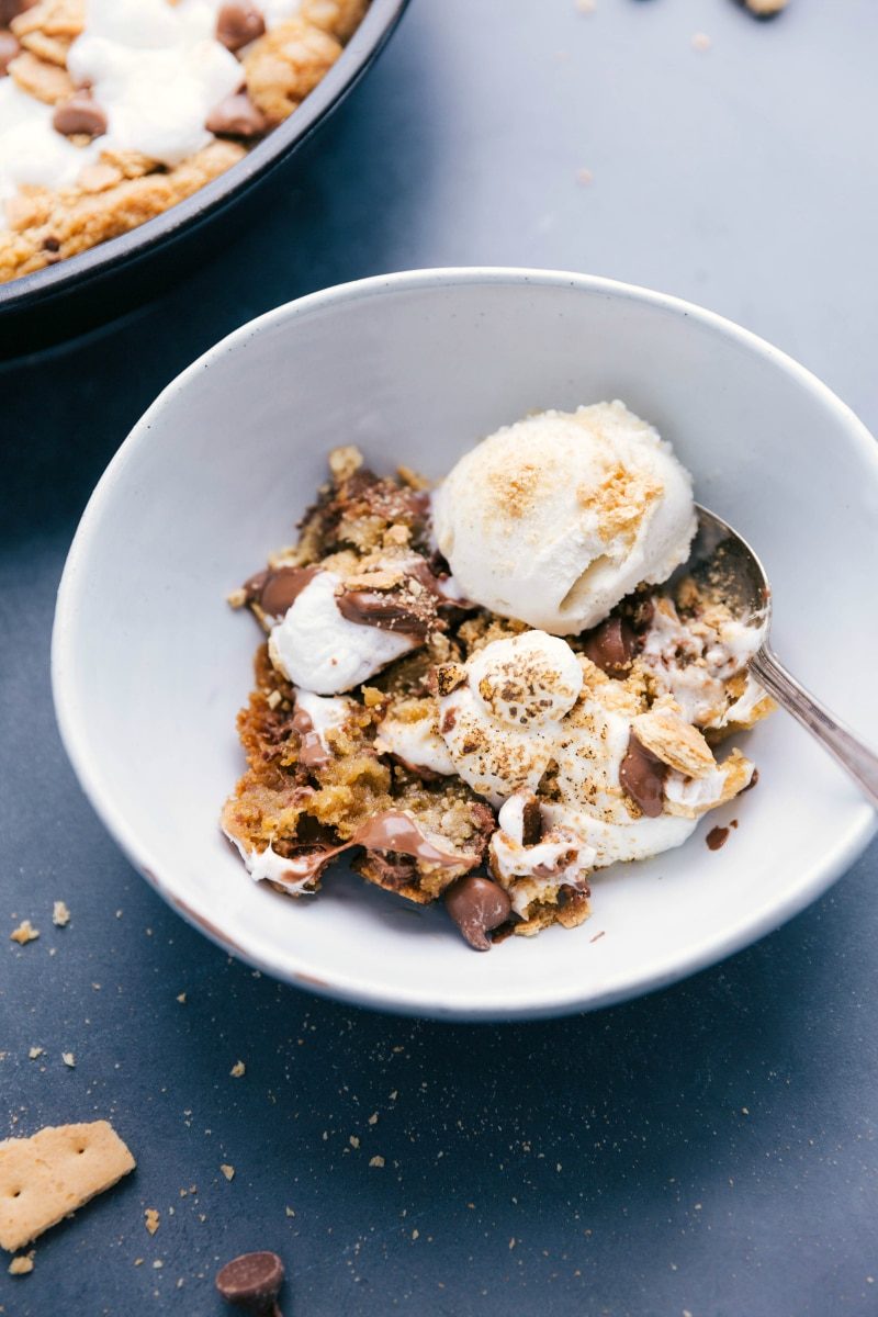 S'mores pizookie in a bowl, topped with ice cream, a reliable blend of warm cookie and cold ice cream.