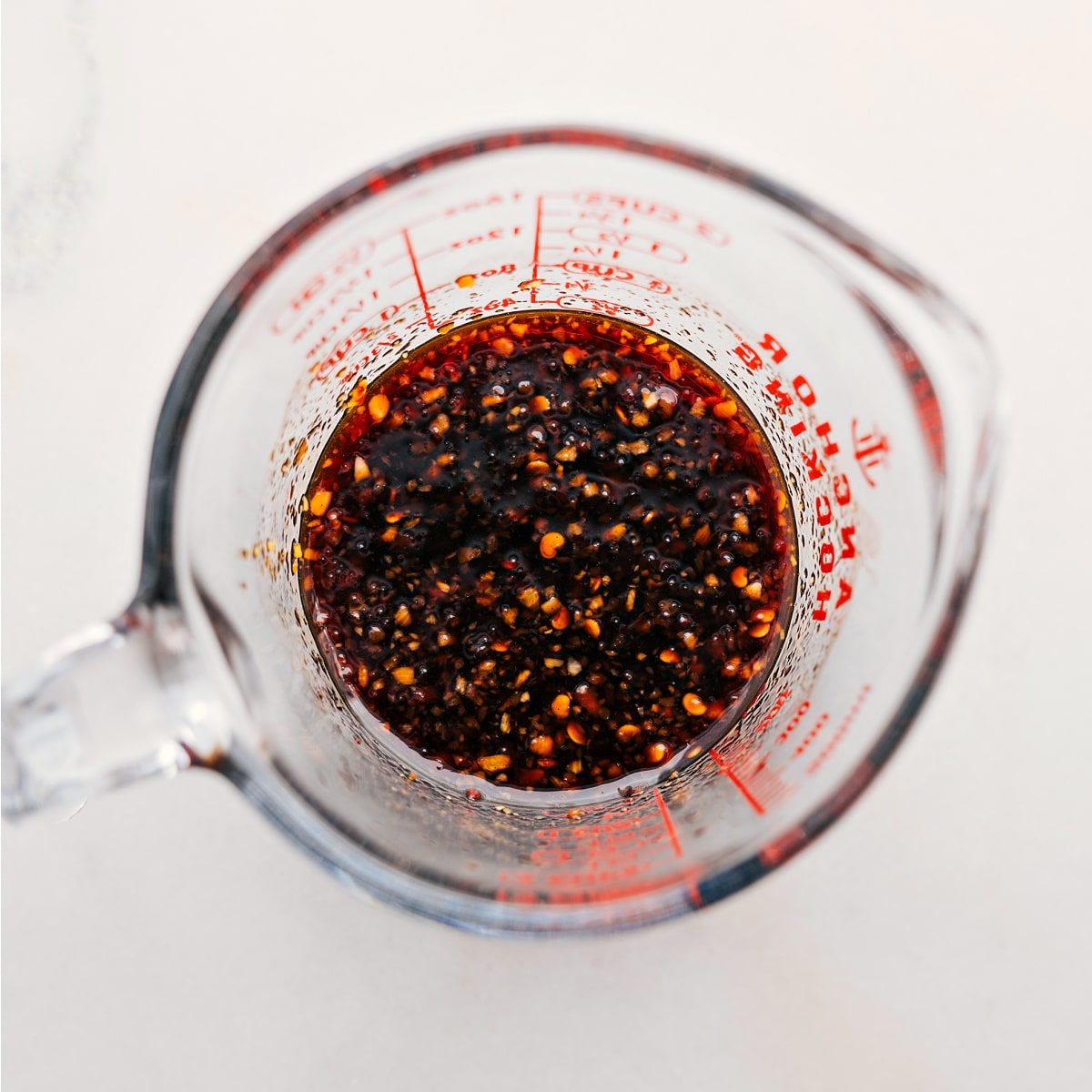 The sauce for these dragon noodles combined in a liquid measuring cup.