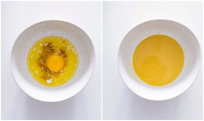 The egg yolk, butter, and vanilla being mixed together in a separate bowl to add to the yeast mixture for this from-scratch cinnamon rolls recipe.