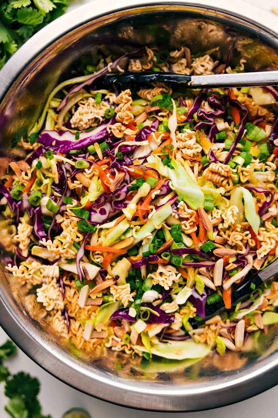 Crunchy ramen noodle salad with fresh cabbage, toasted almonds, and sesame dressing.
