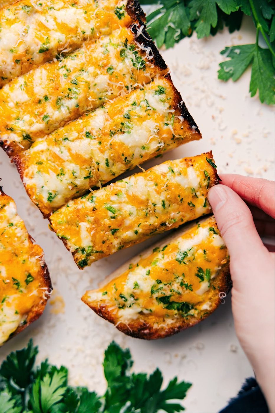 Garlic cheesy bread baked until the edges turn golden and bubbly with deliciously crisp edges.