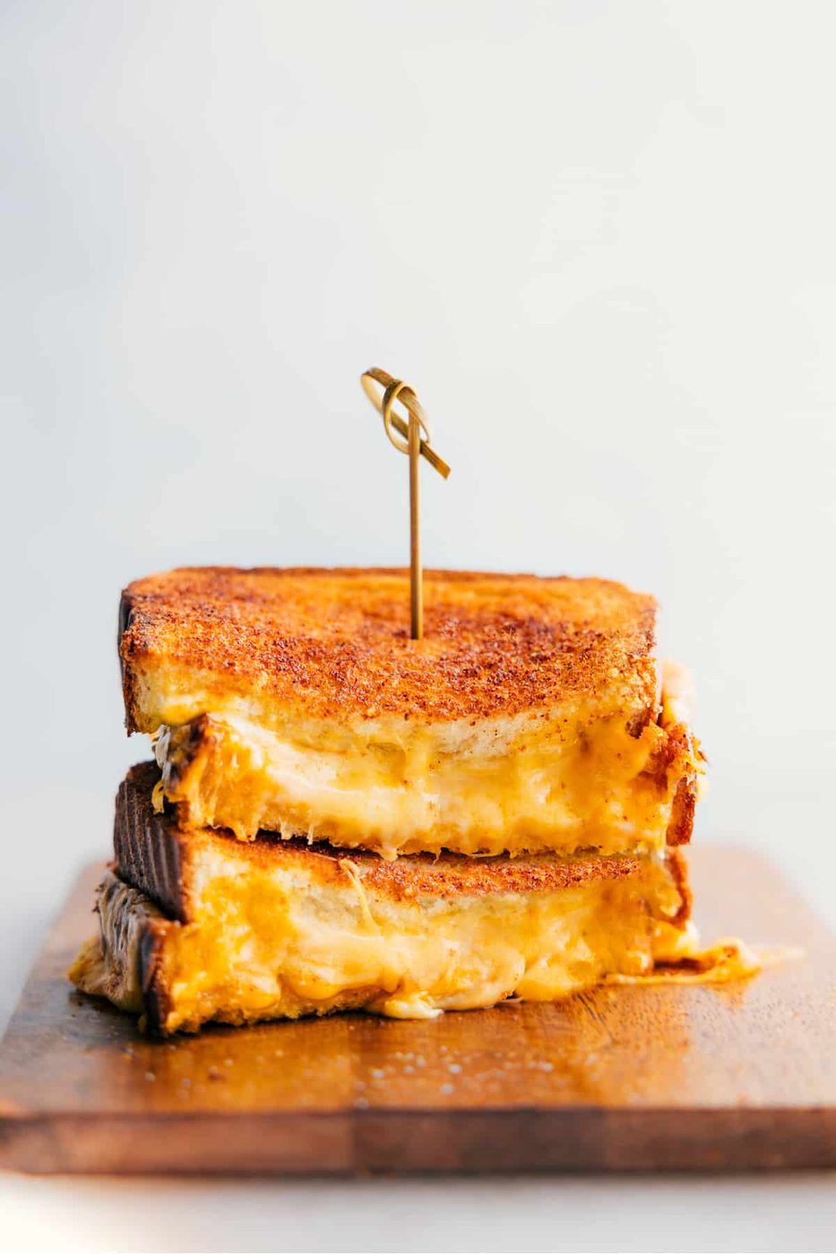 Stacked grilled cheese sandwiches are classic straightforward recipes for kids with a gooey three-cheese center.