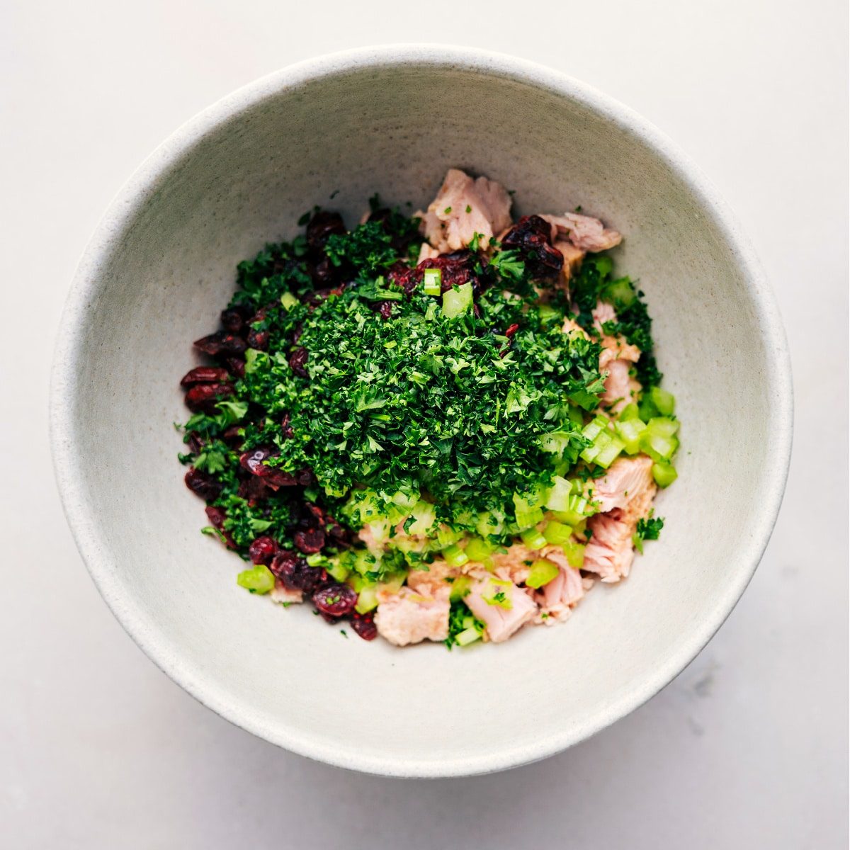 All the ingredients for this straightforward tuna salad go into a bowl, ready to be tossed together.
