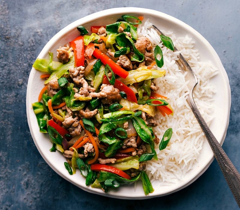 Egg roll in a bowl filling served over a bed of rice, prepared and ready for a satisfying meal.