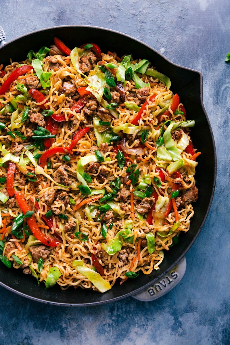 Completed Egg Roll Noodles in a wide skillet, beautifully garnished with fresh green onions.