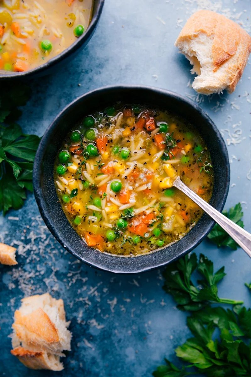 Vegetable noodle soup with vegetables, orzo pasta, and Parmesan, one of these cozy fall soup recipes.