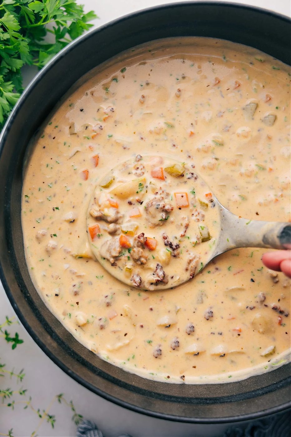 Creamy sausage potato soup with Italian sausage, tender potatoes, and vegetables.