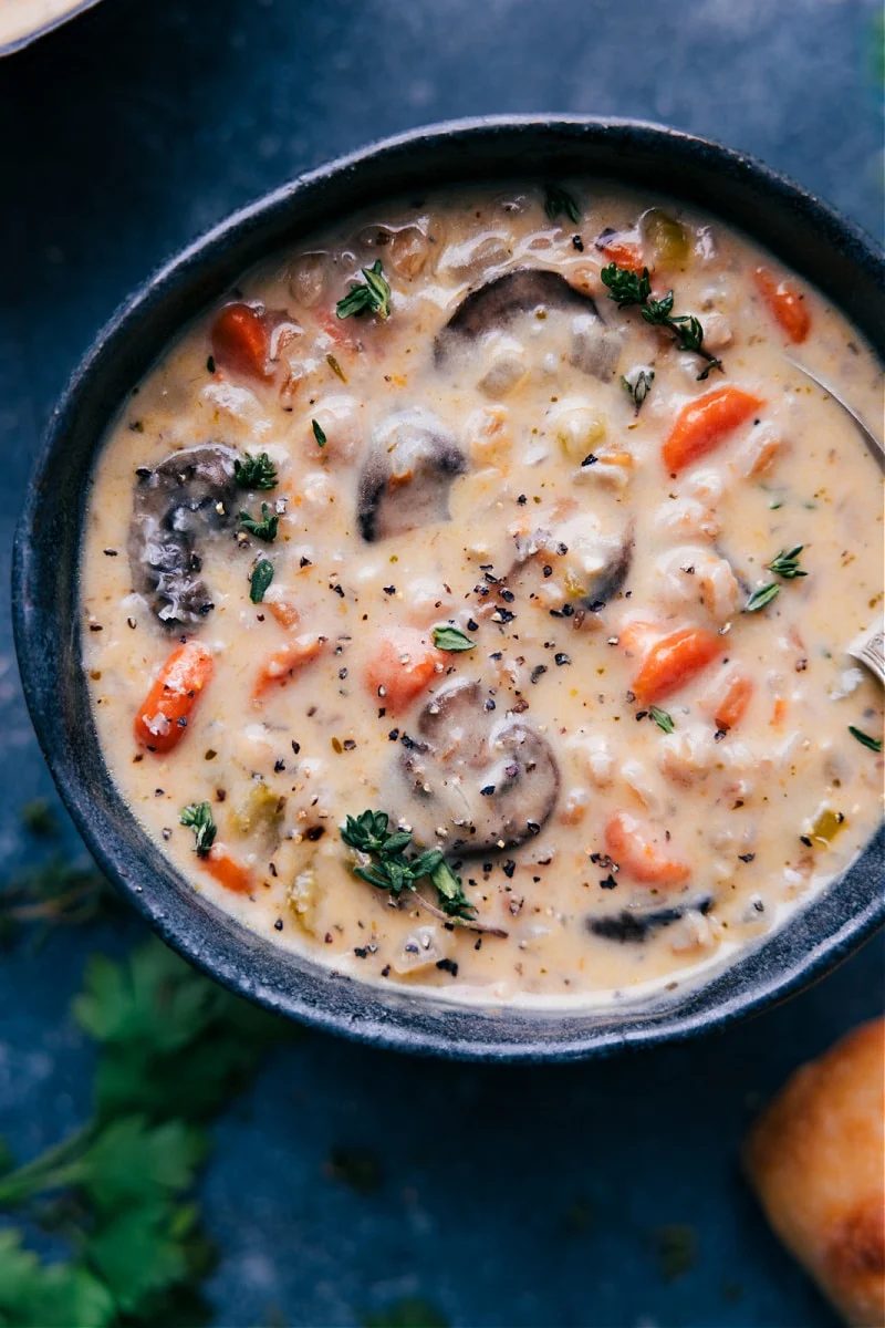 Mushroom carrot soup with mushrooms, vegetables, and tender farro.
