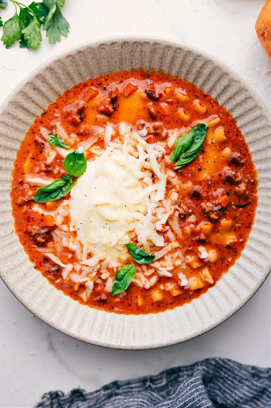 slow cooker lasagna soup with pasta, meat sauce, and plenty of melted cheese.