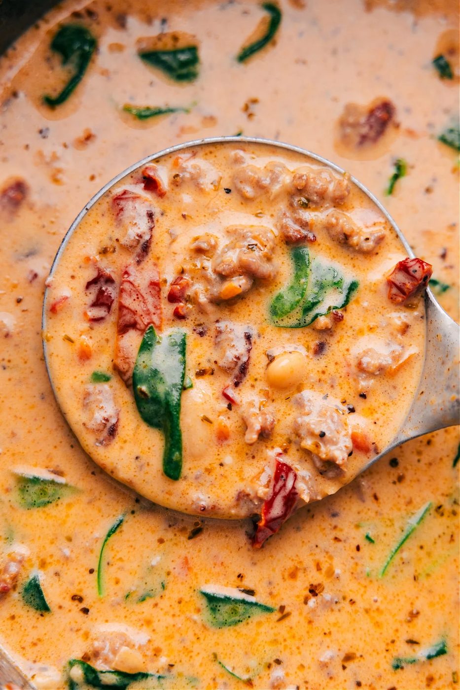 Creamy Tuscan soup with Italian sausage, bacon, white beans, and sun-dried tomatoes.