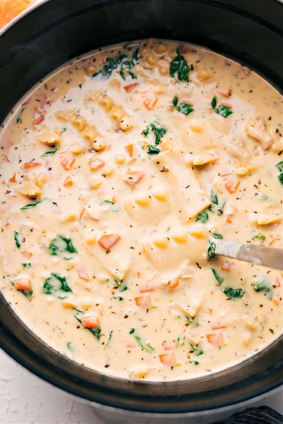 White chicken lasagna soup with chicken, pasta, and creamy Parmesan broth, a rich option for fall soup recipes.