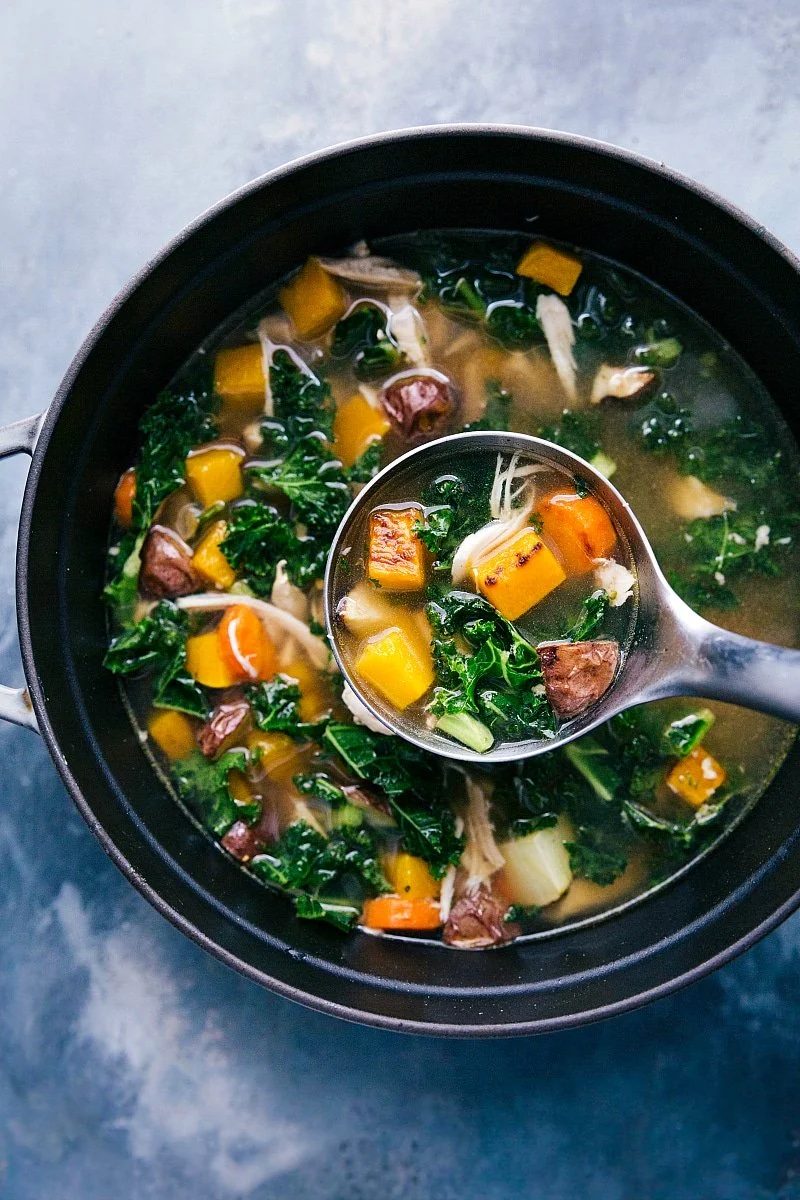 Chicken vegetable soup with shredded chicken, butternut squash, carrots, and potatoes, reliable for fall soup recipes.