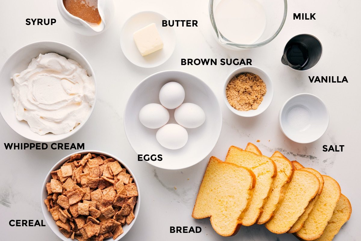 All the ingredients in this recipe prepped out for straightforward assembly including the whipped cream, cereal, bread, eggs, salt, brown sugar, vanilla, milk, butter, and syrup.